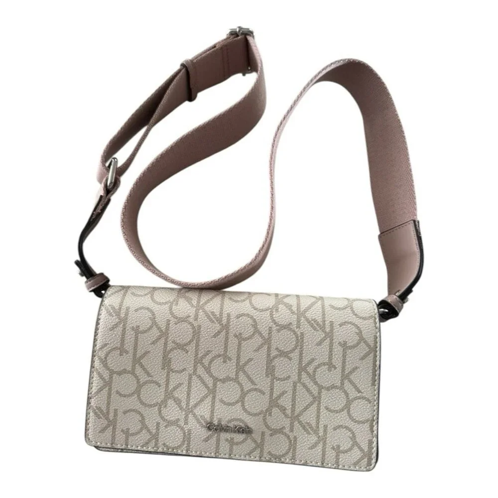 Calvin Klein crossbody bag, specifically identified as a Charlie Flap Crossbody - Picture 1 of 5